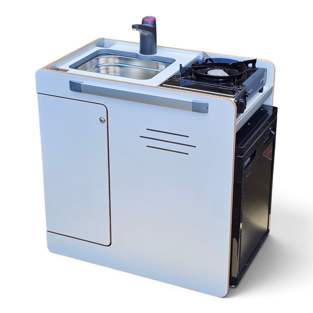 Compact portable kitchen unit with a white cabinet body, black gas burner on top, stainless steel sink, and dark faucet, shown on a clean white background.