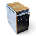 A compact kitchen appliance combo unit, likely a small refrigerator and stove or dishwasher stack, featuring a light wood grain top, a black front door, and a white side cabinet on a white background.