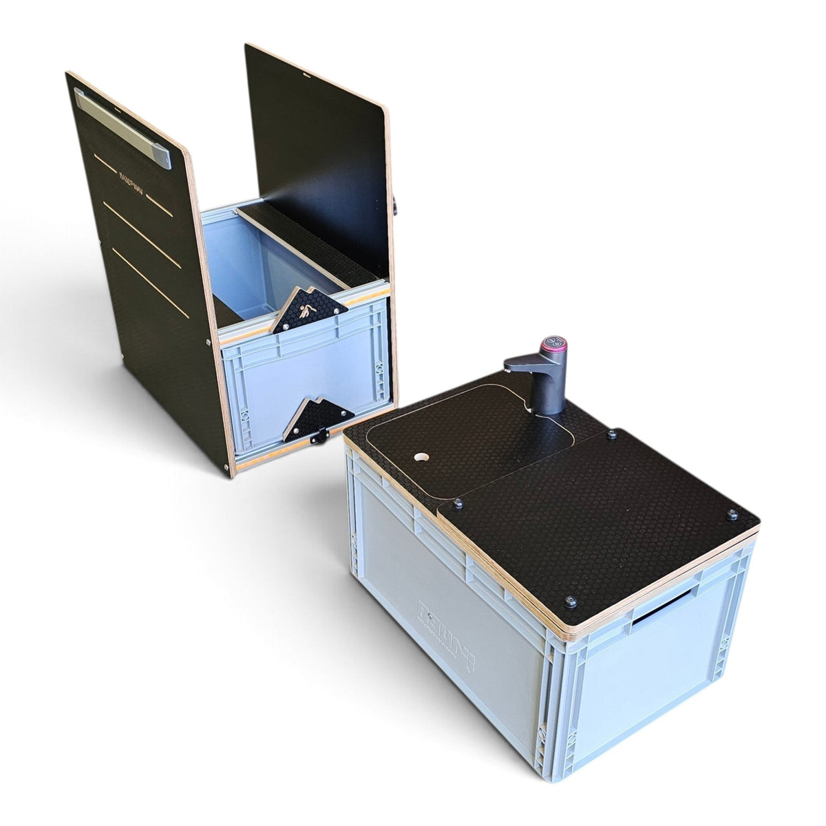 Two portable folding camp tables made from light blue plastic storage crates with black tops, shown on a clean white background. One table is closed, and the other is open to show the interior storage compartment.