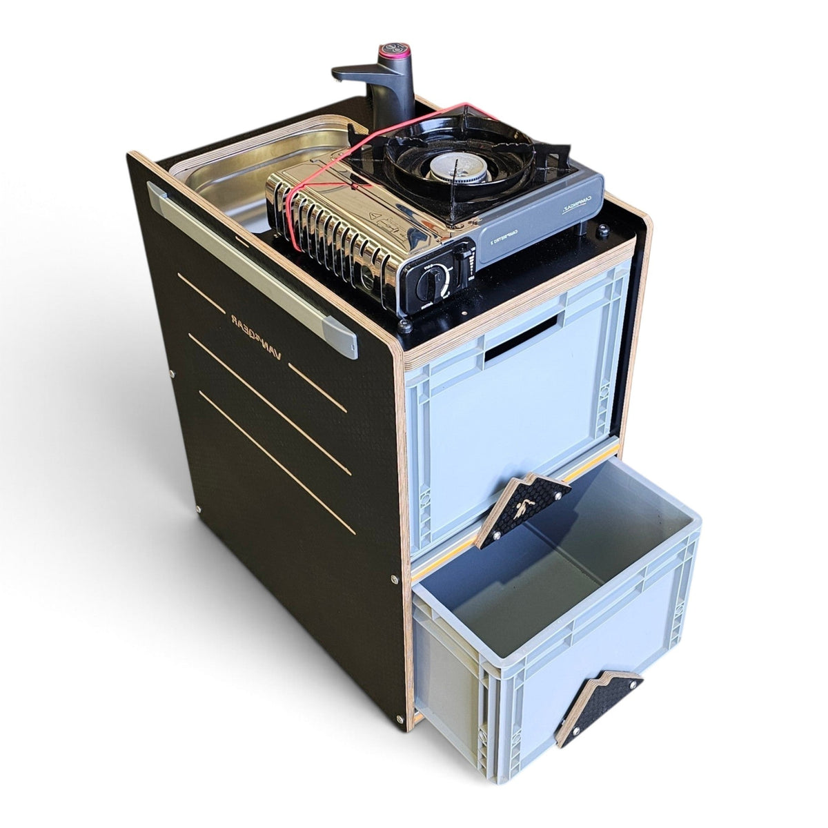 A compact black and light blue outdoor kitchen cabinet with a slide-out drawer, shown on a white background. The top deck is open, displaying a built-in sink, a stainless steel bottle opener, a small fan, and a portable stove.